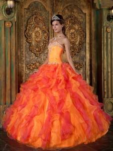 Orange Quinceanera Dress With Beading And Ruffles