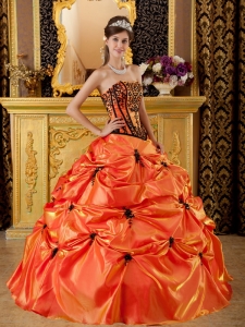 Quinceanera Dress In Orange With Black Details And Pleats